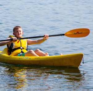 Boy in a yellow ride on Kayak